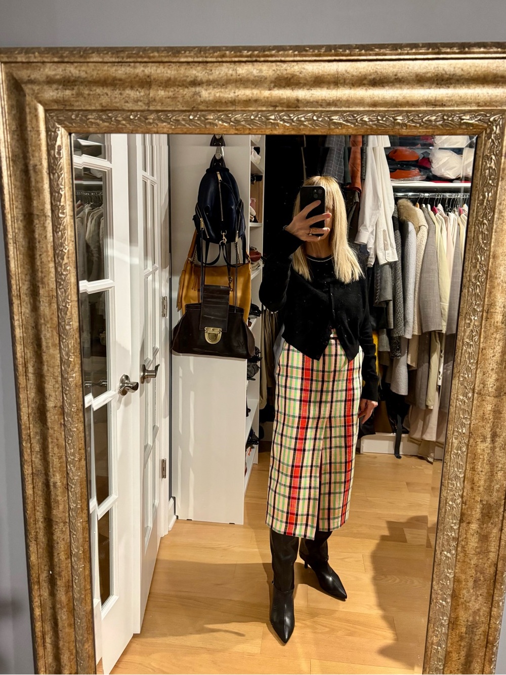 Unique plaid midi skirt with front slit.